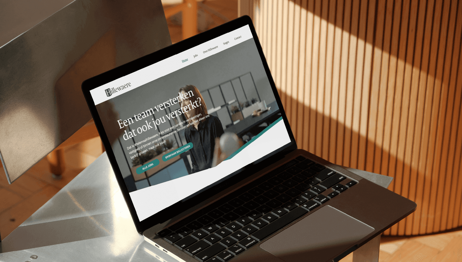 Hillewaere Group Job site mockup - Laptop with homepage
